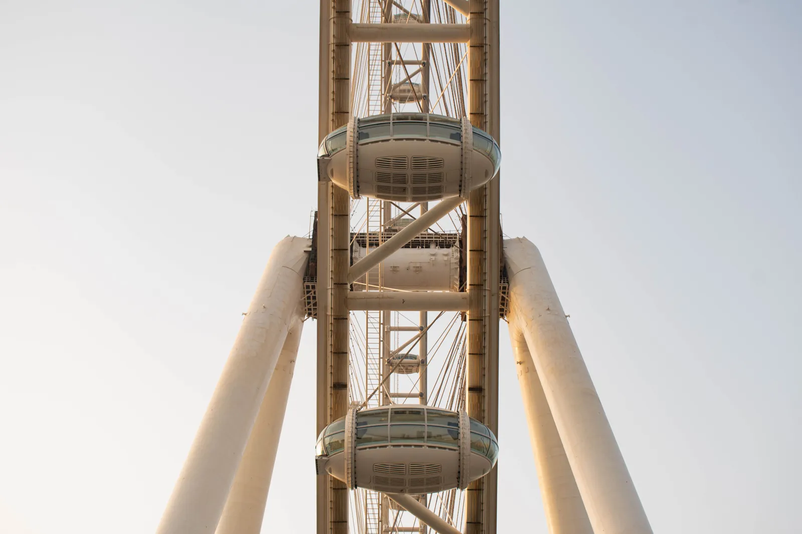 Close view of a glass cabin on the Ain Dubai wheel against a clear sky