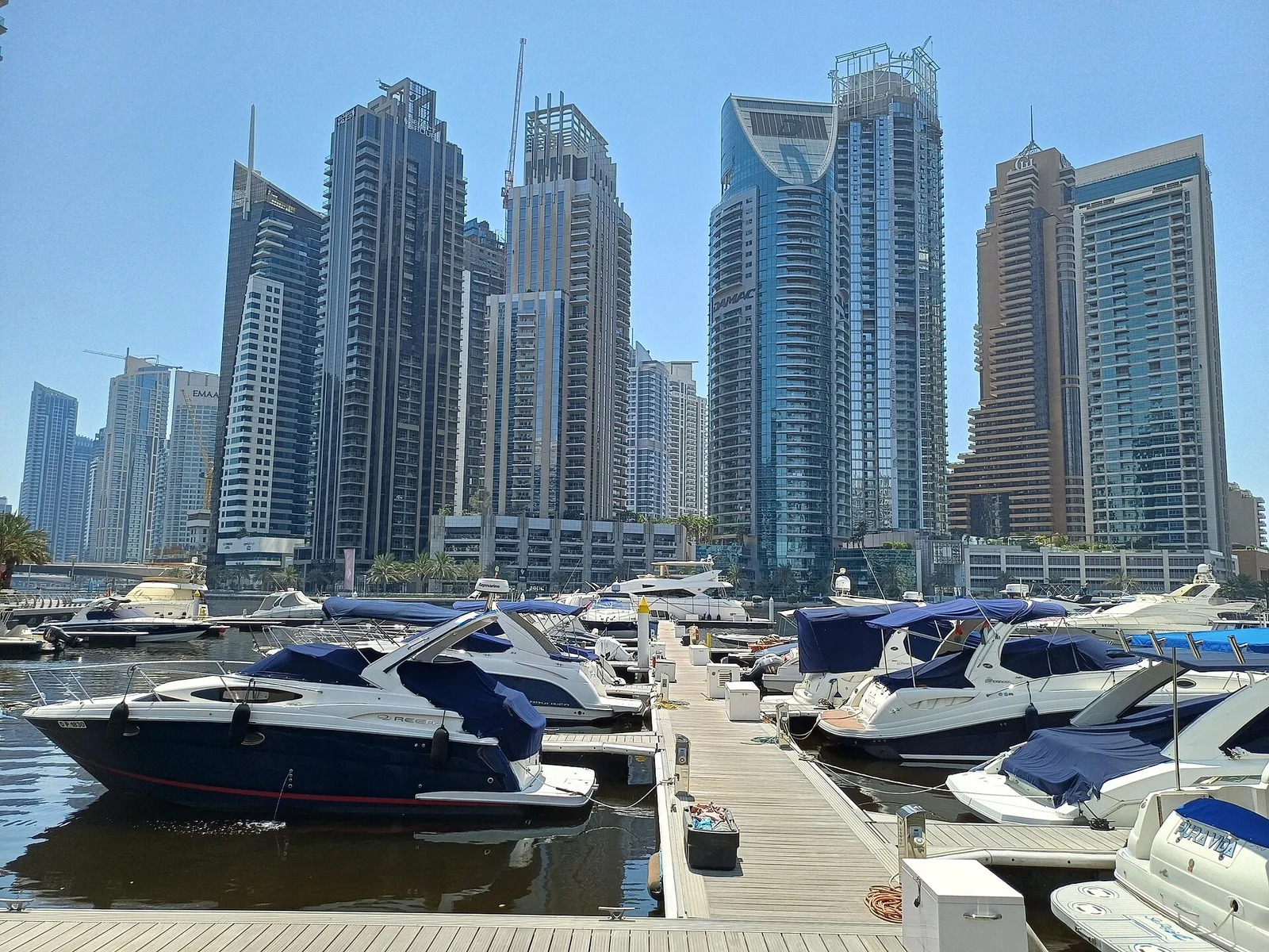 A luxury beachfront resort pool on Palm Jumeirah with the Dubai coastline beyond
