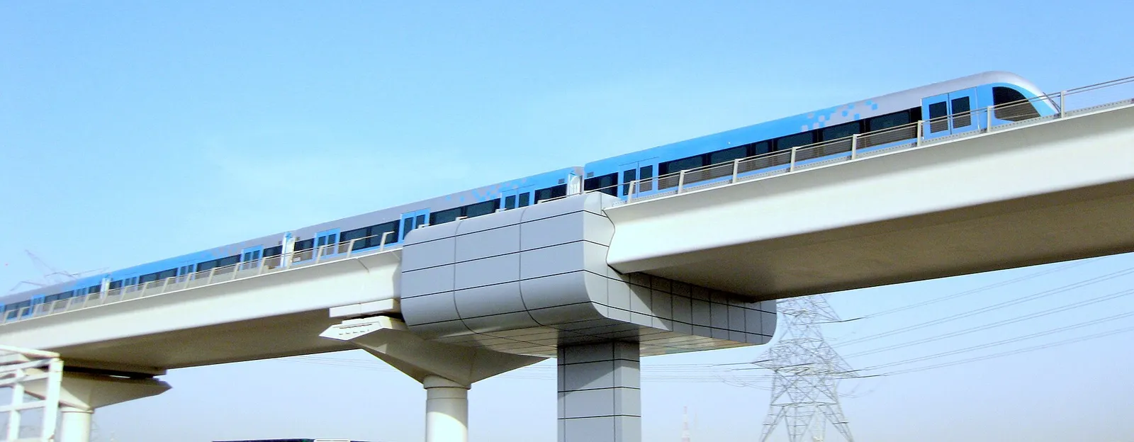 A Dubai Metro train crossing an elevated viaduct in Dubai, United Arab Emirates