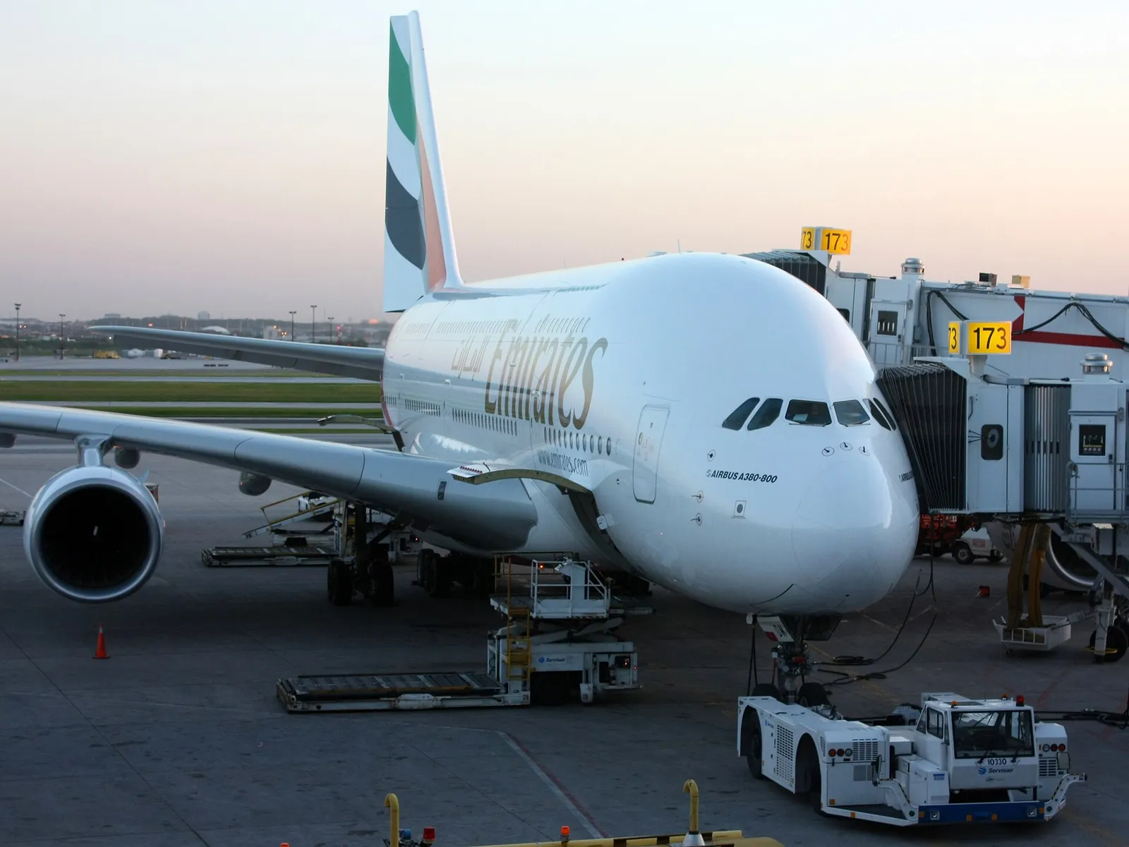 An Emirates A380 parked at a gate at Dubai International Airport, United Arab Emirates