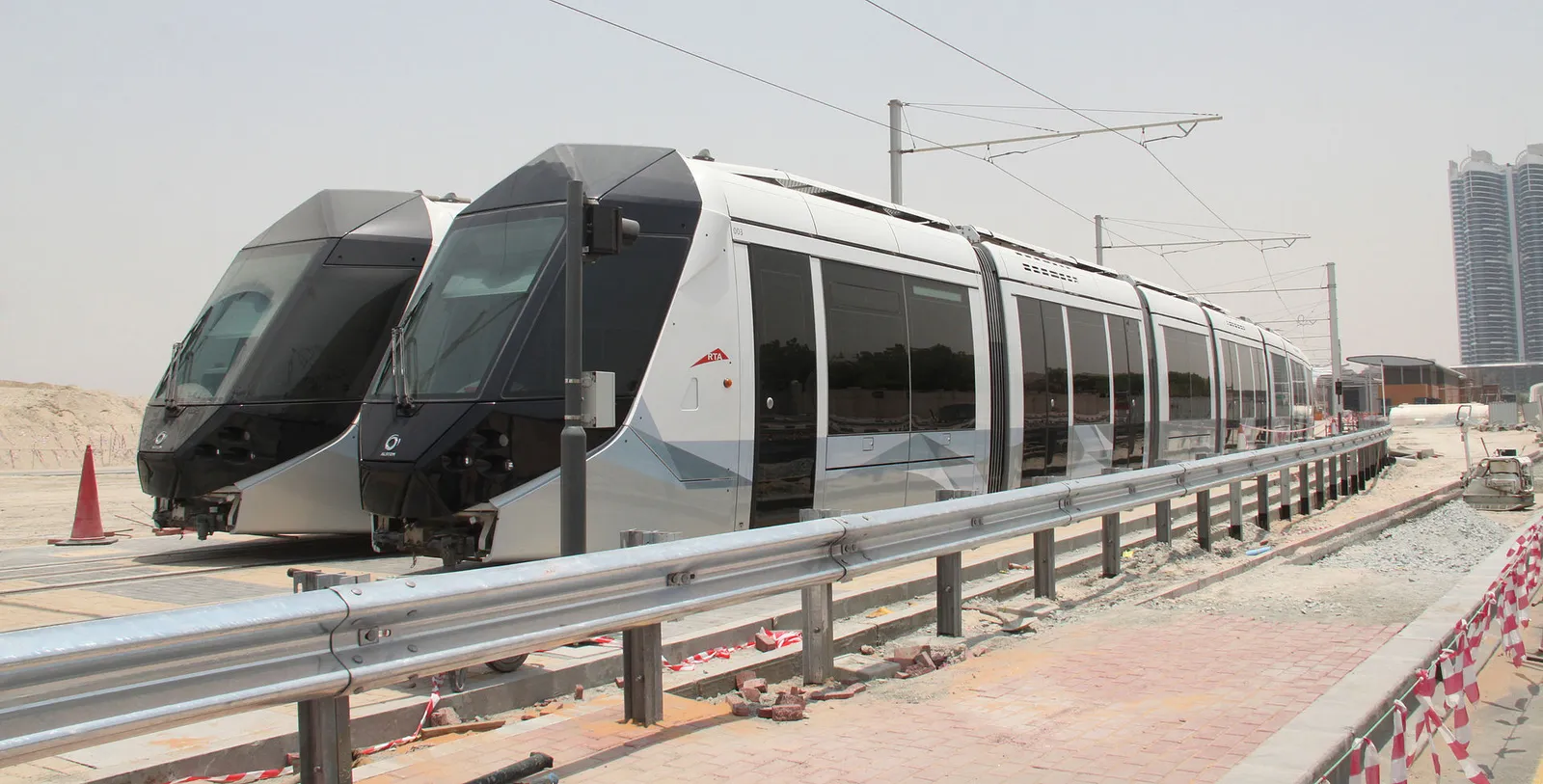A modern tram running on a track in Dubai, United Arab Emirates