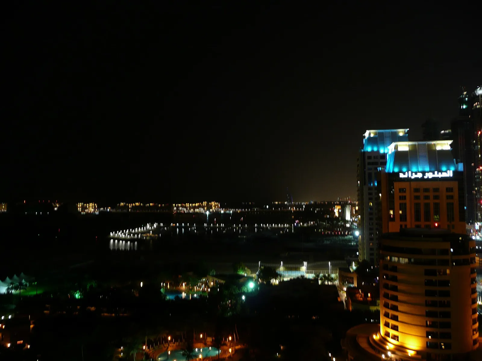 Residential towers lit up at night in Dubai, United Arab Emirates
