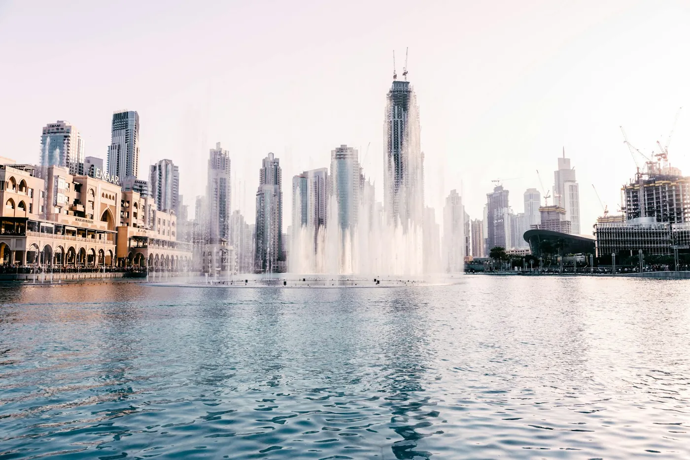Burj Khalifa Lake in front of Dubai Mall in daylight, where the Dubai Fountain performs