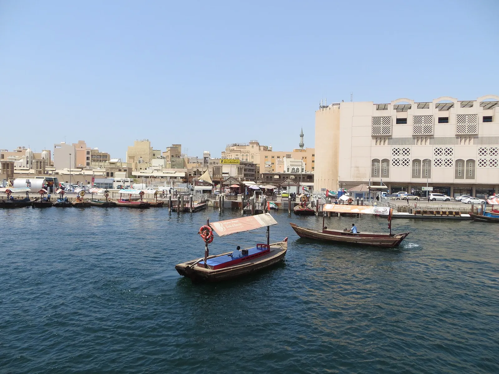 Abra boats crossing Dubai Creek beside the old district, United Arab Emirates
