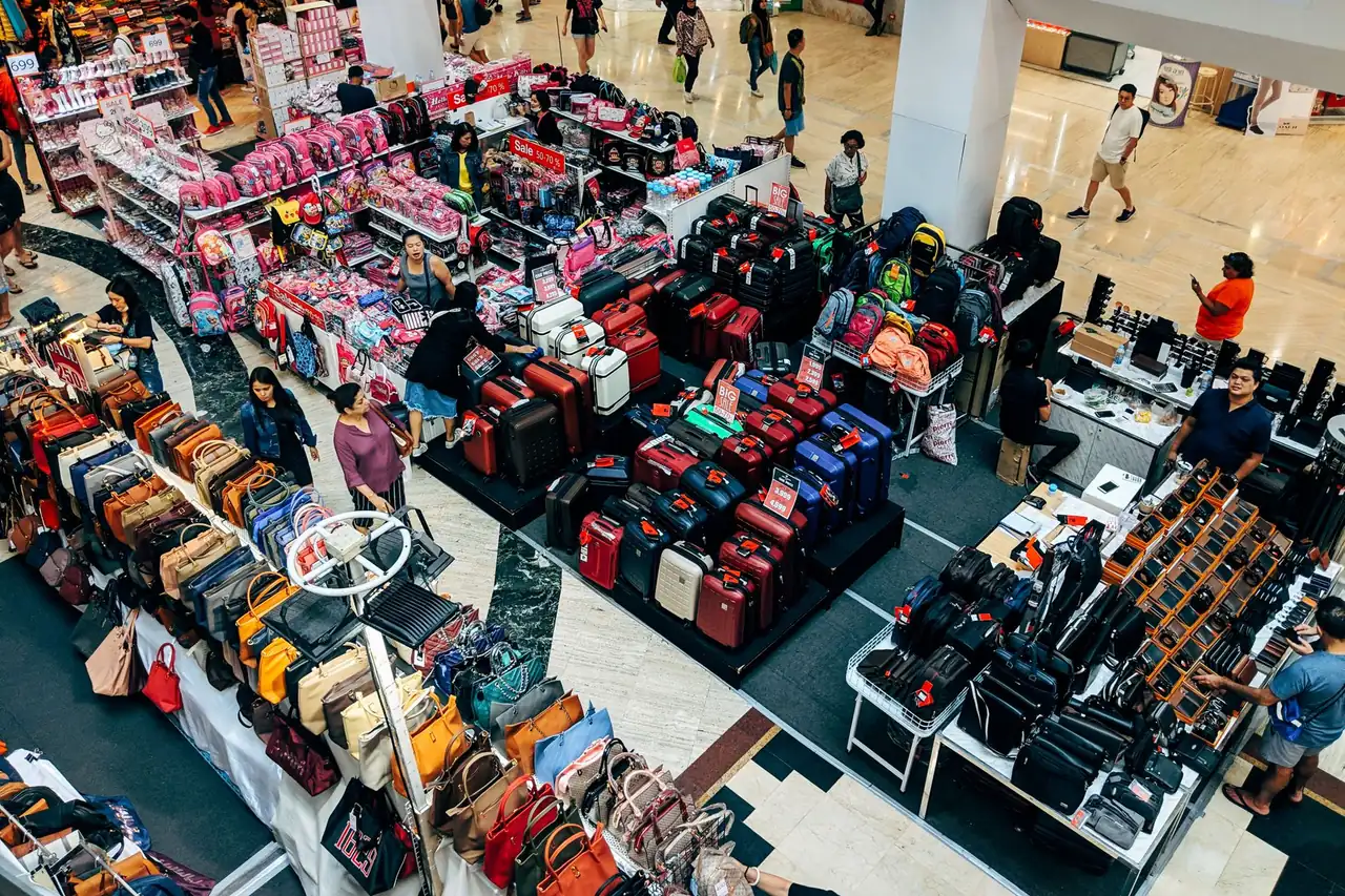 Discount sale racks inside a Dubai outlet mall during Dubai Summer Surprises