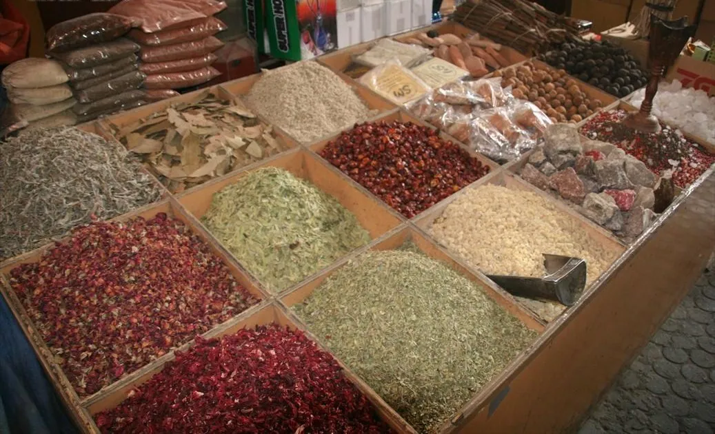 Stalls of spices and dried goods in the souk district of Dubai, UAE