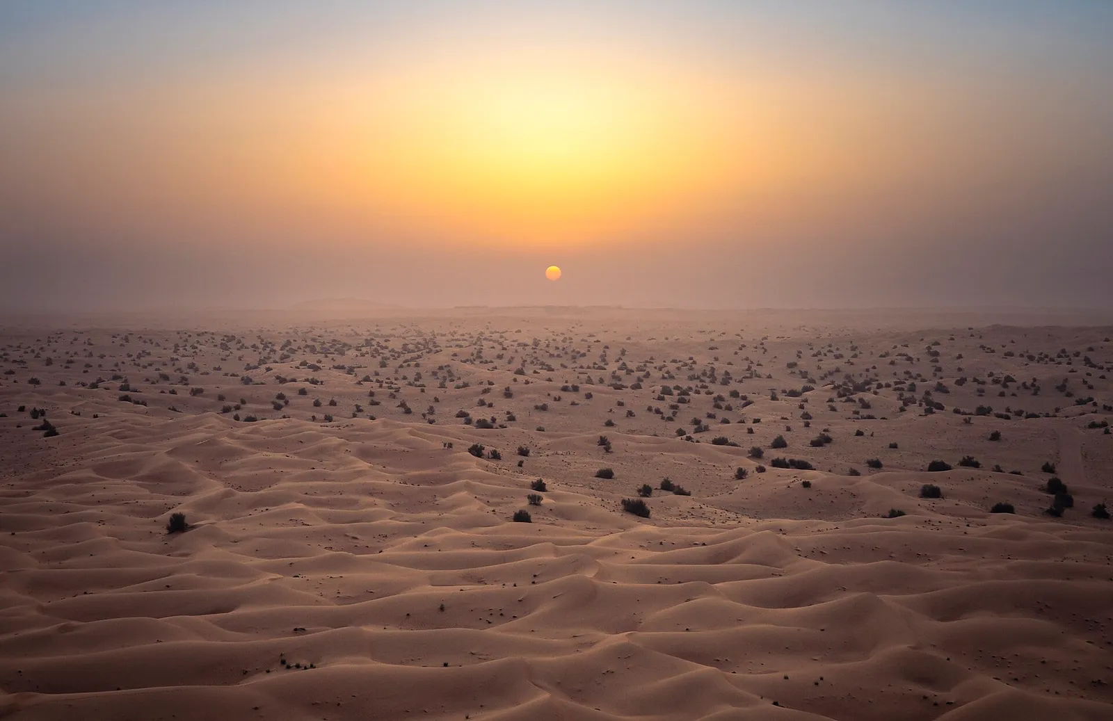 Sunrise over the sand dunes of the desert outside Dubai, United Arab Emirates