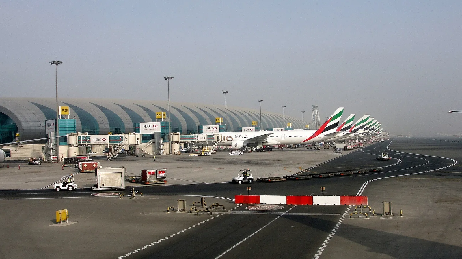 Emirates aircraft parked at gates at Dubai International Airport, United Arab Emirates