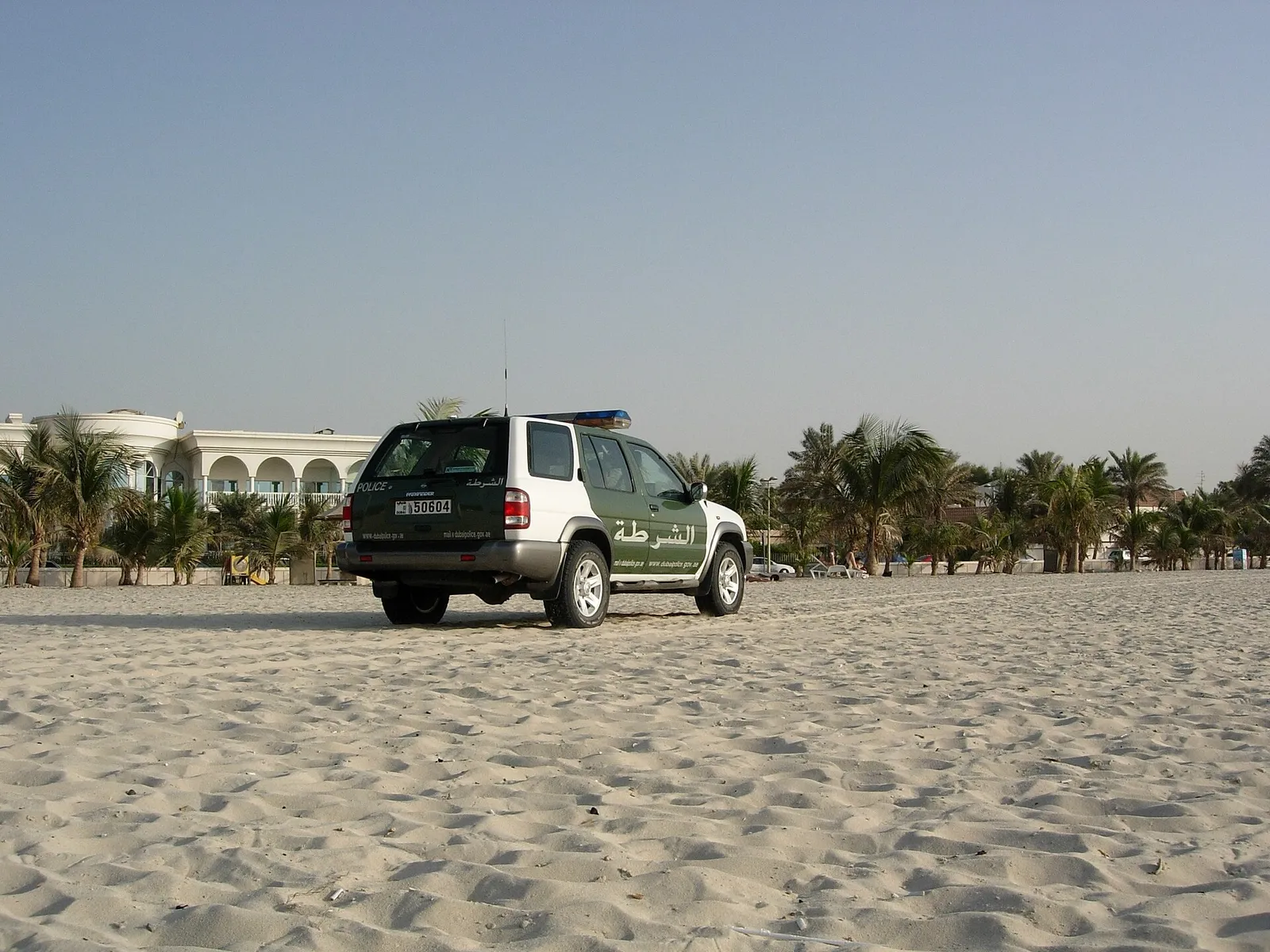 A Dubai Police vehicle patrolling a beach in Dubai, United Arab Emirates