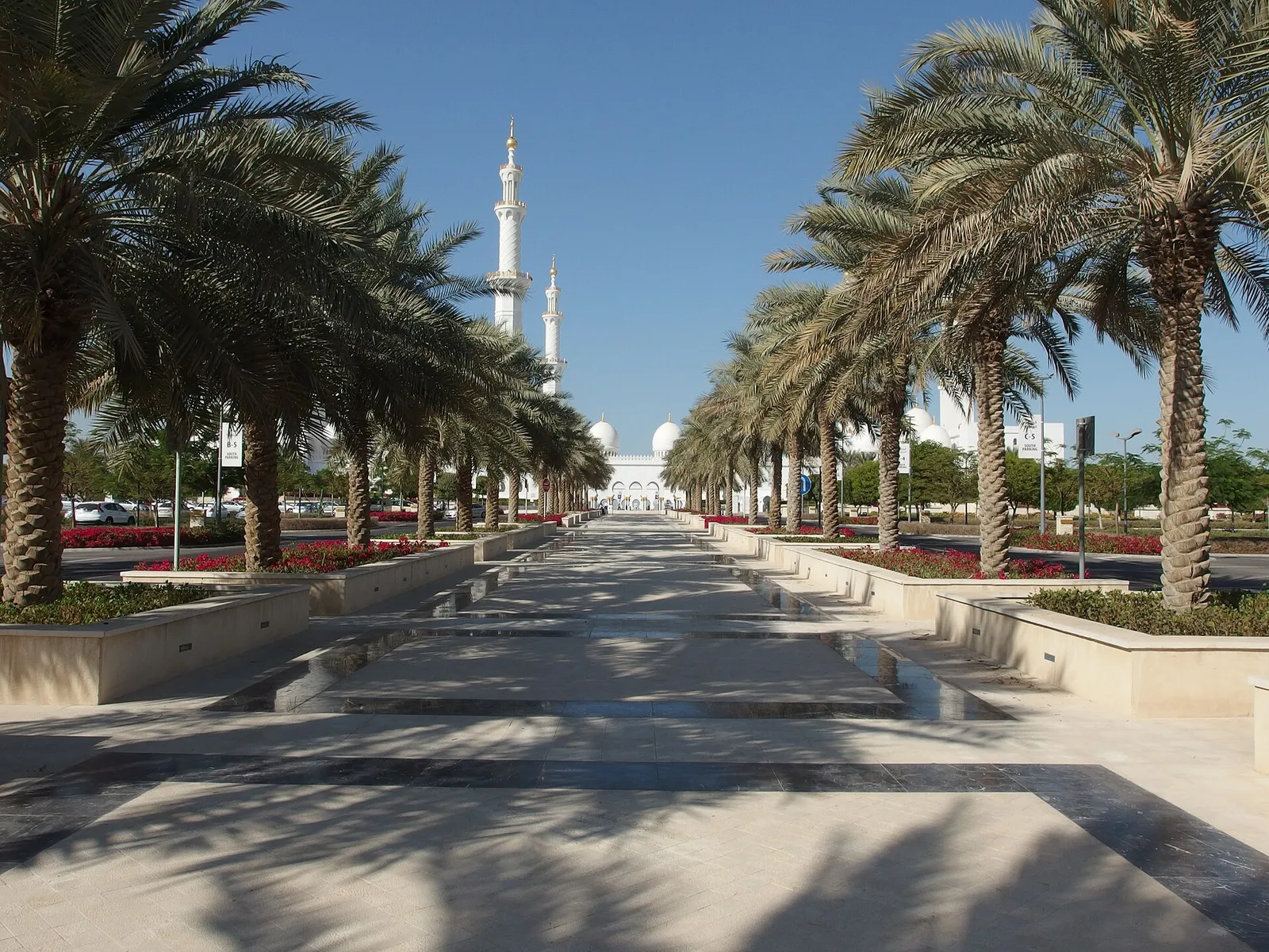 A palm lined avenue leading to the Sheikh Zayed Grand Mosque in Abu Dhabi, United Arab Emirates