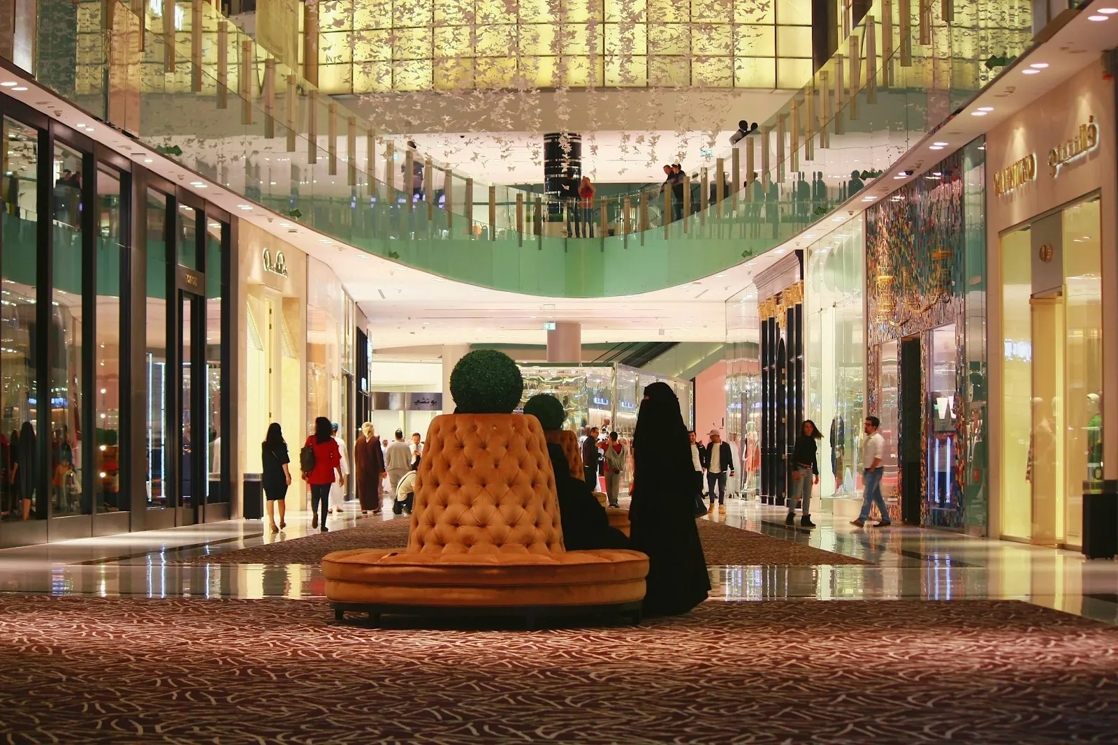 Busy air-conditioned interior of The Dubai Mall during a summer shopping festival in Dubai