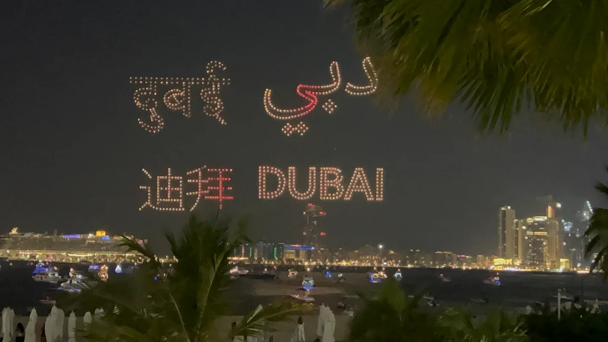 A drone show above the water at night