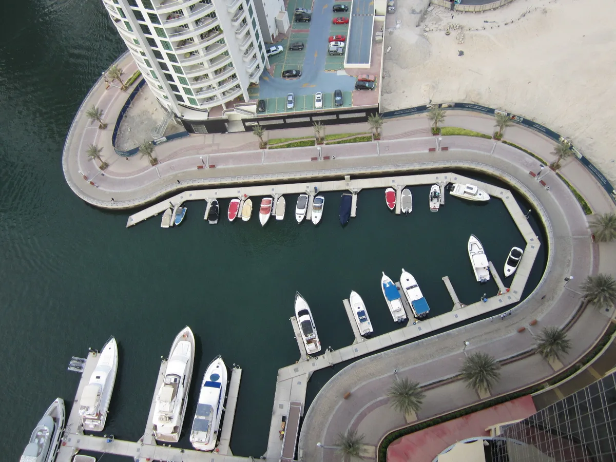 Yachts moored in a marina seen from above