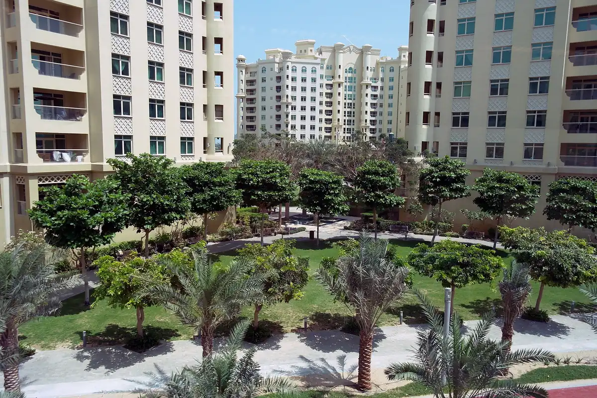 A green garden between residential buildings