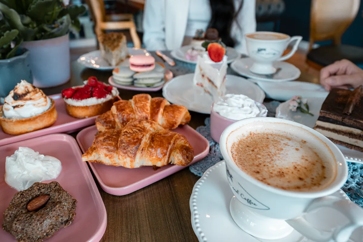 A brunch table with pastries and coffee
