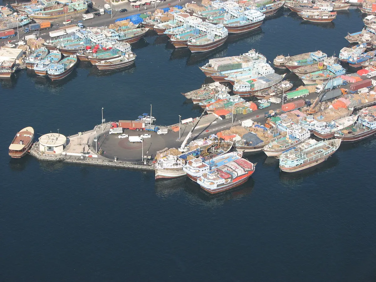 Fishing boats packed in a harbour seen from above